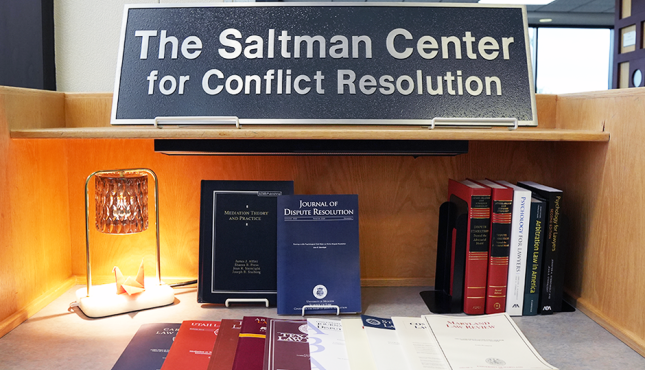 Photo of photos, journals, and Saltman Center sign